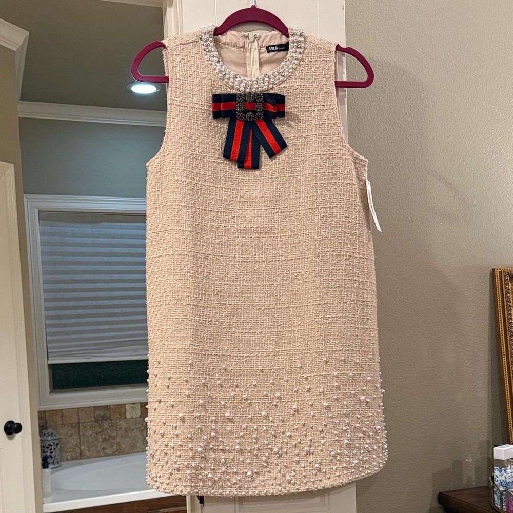 Elegant Cream Sleeveless Dress with Bow Accent